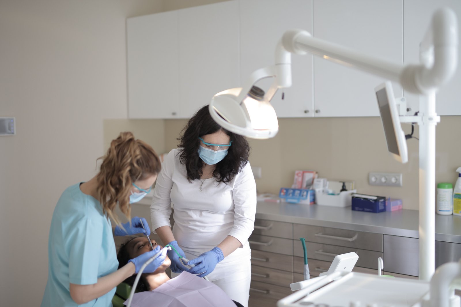 Dental staff caring for a patient in a bright, clean treatment room